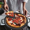 image:imageNutriChef 13Inch Flat Cast Iron Pizza Pan  Versatile PreSeasoned Round Cooking Griddle wBuiltIn Handles for Oven Grill Stove and Campfires  Includes 2 Heat Safe Silicone Grips